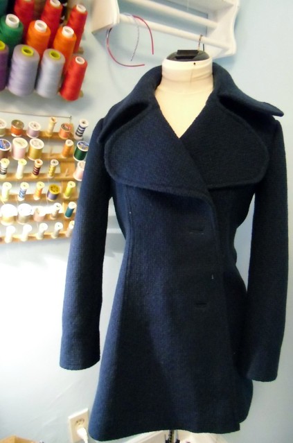 coat with topstitching