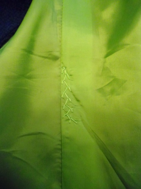 Coat - feather stitched lining pleat