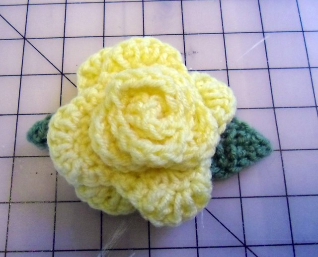 Crocheted yellow rose pin